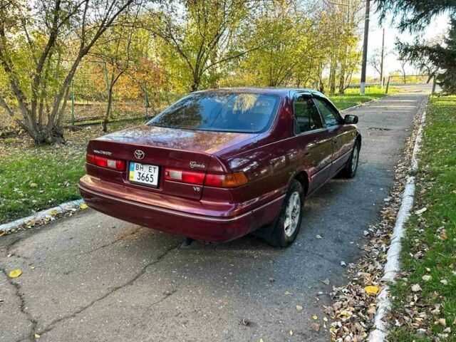 Красный Тойота Камри, объемом двигателя 3 л и пробегом 340 тыс. км за 2950 $, фото 3 на Automoto.ua