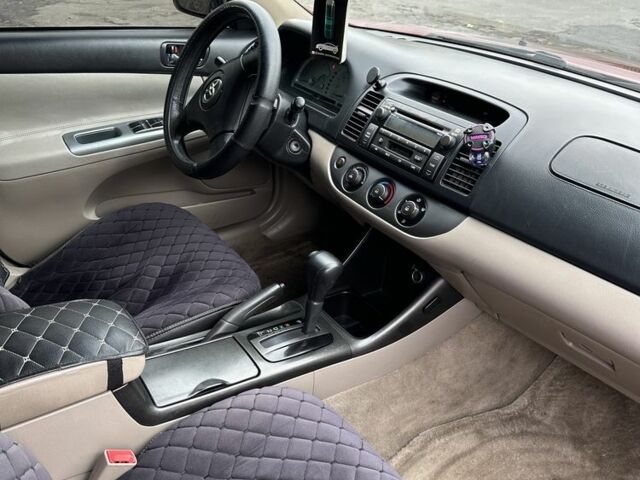 Красный Тойота Камри, объемом двигателя 2.4 л и пробегом 246 тыс. км за 4100 $, фото 17 на Automoto.ua