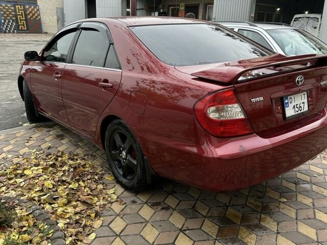 Красный Тойота Камри, объемом двигателя 2.4 л и пробегом 246 тыс. км за 4100 $, фото 10 на Automoto.ua