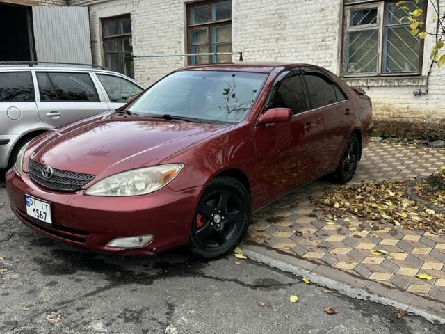 Красный Тойота Камри, объемом двигателя 2.4 л и пробегом 246 тыс. км за 4100 $, фото 5 на Automoto.ua