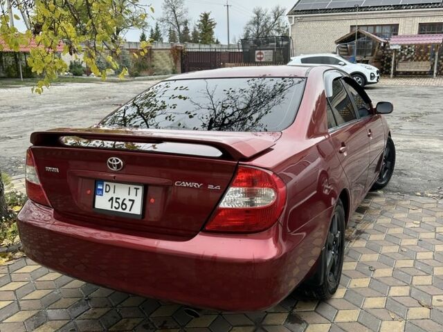 Красный Тойота Камри, объемом двигателя 2.4 л и пробегом 246 тыс. км за 4100 $, фото 13 на Automoto.ua
