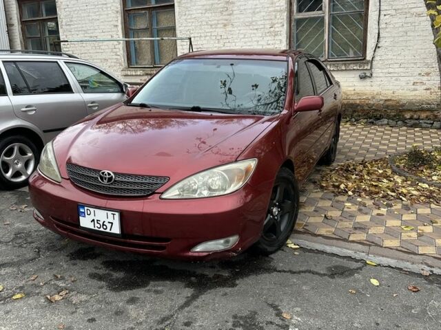 Красный Тойота Камри, объемом двигателя 2.4 л и пробегом 246 тыс. км за 4100 $, фото 1 на Automoto.ua