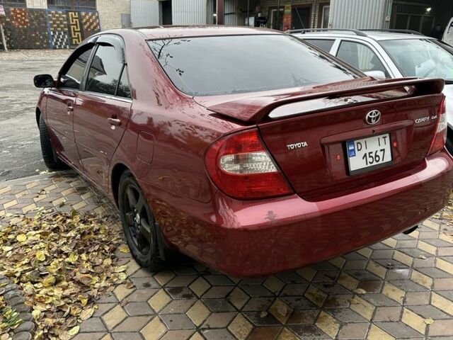 Красный Тойота Камри, объемом двигателя 2.4 л и пробегом 246 тыс. км за 4100 $, фото 9 на Automoto.ua