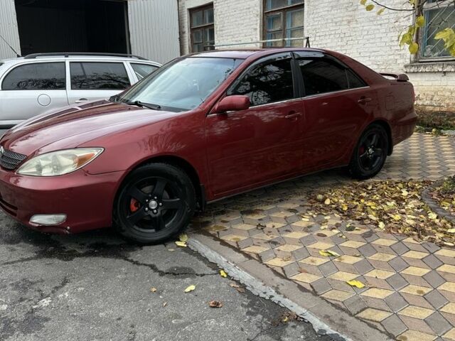 Красный Тойота Камри, объемом двигателя 2.4 л и пробегом 246 тыс. км за 4100 $, фото 7 на Automoto.ua