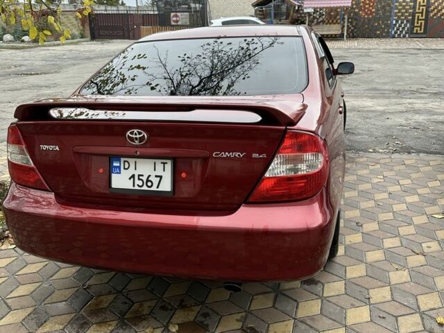 Красный Тойота Камри, объемом двигателя 2.4 л и пробегом 246 тыс. км за 4100 $, фото 14 на Automoto.ua