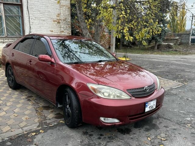 Красный Тойота Камри, объемом двигателя 2.4 л и пробегом 246 тыс. км за 4100 $, фото 4 на Automoto.ua