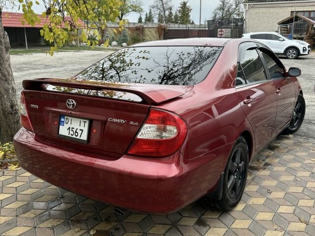 Красный Тойота Камри, объемом двигателя 2.4 л и пробегом 246 тыс. км за 4100 $, фото 11 на Automoto.ua