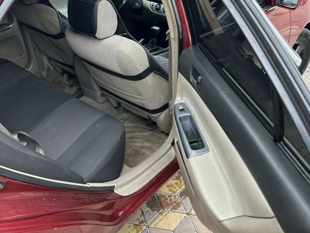 Красный Тойота Камри, объемом двигателя 2.4 л и пробегом 246 тыс. км за 4100 $, фото 15 на Automoto.ua