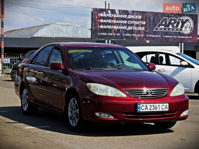 Красный Тойота Камри, объемом двигателя 2.36 л и пробегом 261 тыс. км за 5950 $, фото 1 на Automoto.ua
