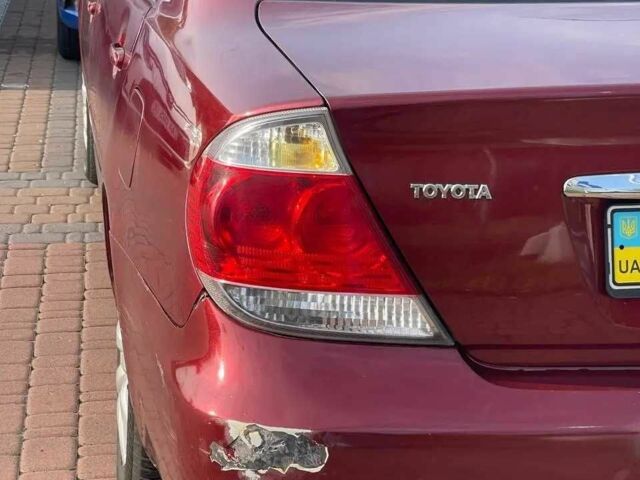 Красный Тойота Камри, объемом двигателя 2.4 л и пробегом 301 тыс. км за 4499 $, фото 6 на Automoto.ua