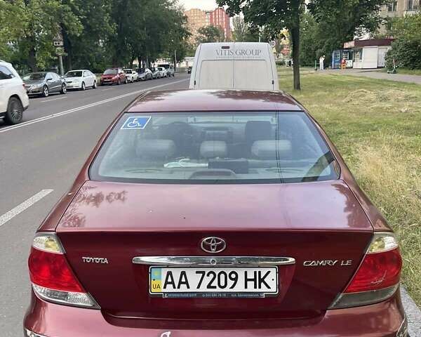 Красный Тойота Камри, объемом двигателя 2.4 л и пробегом 301 тыс. км за 5300 $, фото 22 на Automoto.ua