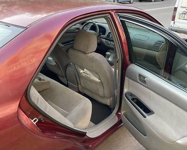 Красный Тойота Камри, объемом двигателя 2.4 л и пробегом 301 тыс. км за 5300 $, фото 10 на Automoto.ua