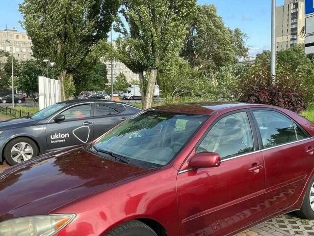 Красный Тойота Камри, объемом двигателя 2.4 л и пробегом 301 тыс. км за 4499 $, фото 4 на Automoto.ua