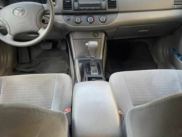 Красный Тойота Камри, объемом двигателя 2.4 л и пробегом 301 тыс. км за 4499 $, фото 14 на Automoto.ua