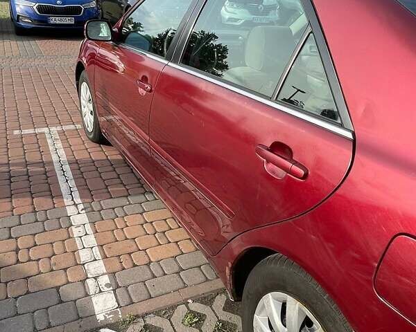 Красный Тойота Камри, объемом двигателя 2.4 л и пробегом 301 тыс. км за 5300 $, фото 6 на Automoto.ua