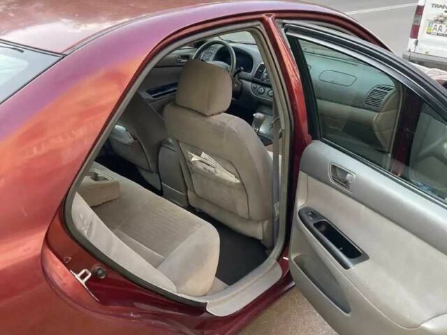 Красный Тойота Камри, объемом двигателя 2.4 л и пробегом 301 тыс. км за 4499 $, фото 8 на Automoto.ua