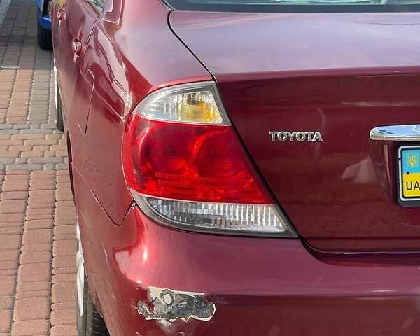 Красный Тойота Камри, объемом двигателя 2.4 л и пробегом 301 тыс. км за 5300 $, фото 7 на Automoto.ua