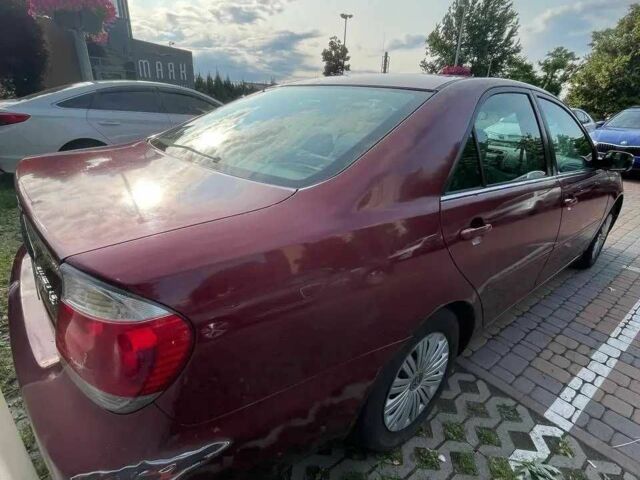 Красный Тойота Камри, объемом двигателя 2.4 л и пробегом 301 тыс. км за 4499 $, фото 1 на Automoto.ua