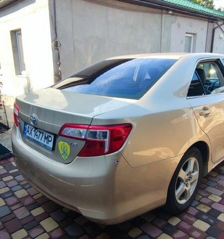 Желтый Тойота Камри, объемом двигателя 2.5 л и пробегом 250 тыс. км за 9000 $, фото 2 на Automoto.ua