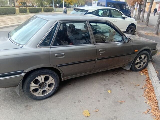 Серый Тойота Камри, объемом двигателя 2 л и пробегом 359 тыс. км за 1300 $, фото 2 на Automoto.ua