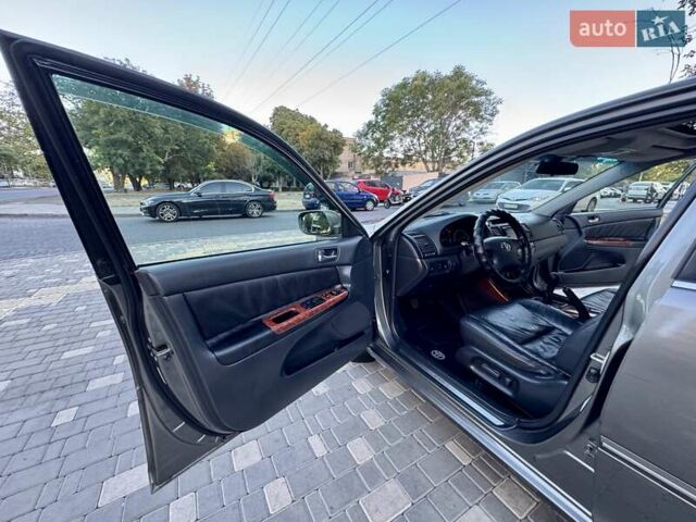 Серый Тойота Камри, объемом двигателя 2.4 л и пробегом 257 тыс. км за 5400 $, фото 51 на Automoto.ua