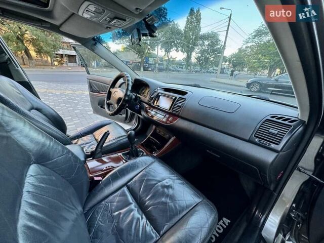 Серый Тойота Камри, объемом двигателя 2.4 л и пробегом 257 тыс. км за 5400 $, фото 32 на Automoto.ua