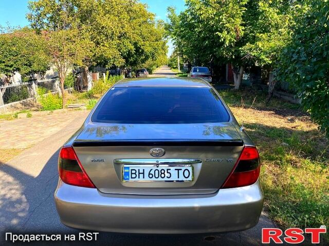 Сірий Тойота Камрі, об'ємом двигуна 3 л та пробігом 390 тис. км за 6000 $, фото 4 на Automoto.ua