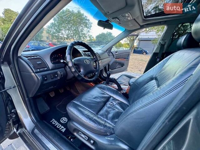 Серый Тойота Камри, объемом двигателя 2.4 л и пробегом 257 тыс. км за 5400 $, фото 44 на Automoto.ua