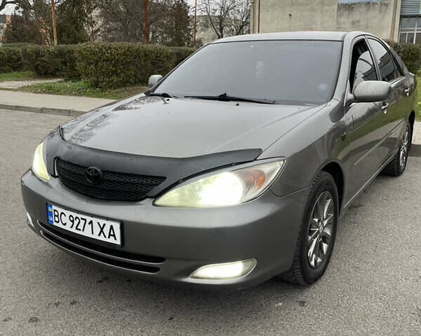 Сірий Тойота Камрі, об'ємом двигуна 3 л та пробігом 384 тис. км за 5500 $, фото 1 на Automoto.ua