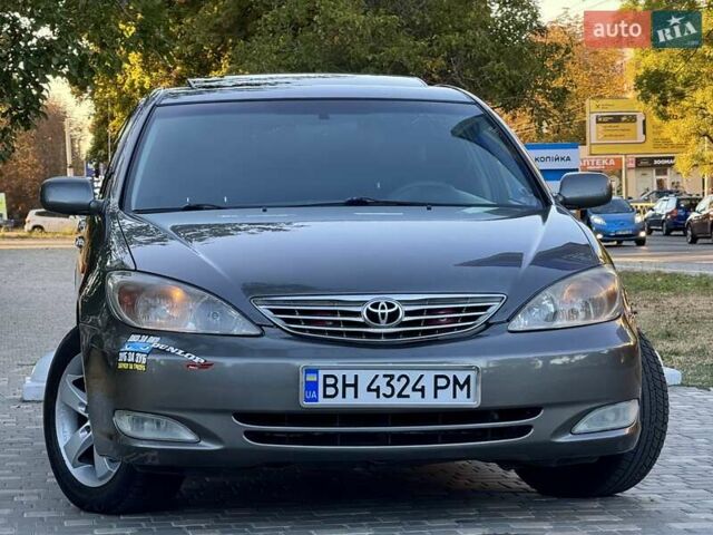 Серый Тойота Камри, объемом двигателя 2.4 л и пробегом 257 тыс. км за 5400 $, фото 66 на Automoto.ua