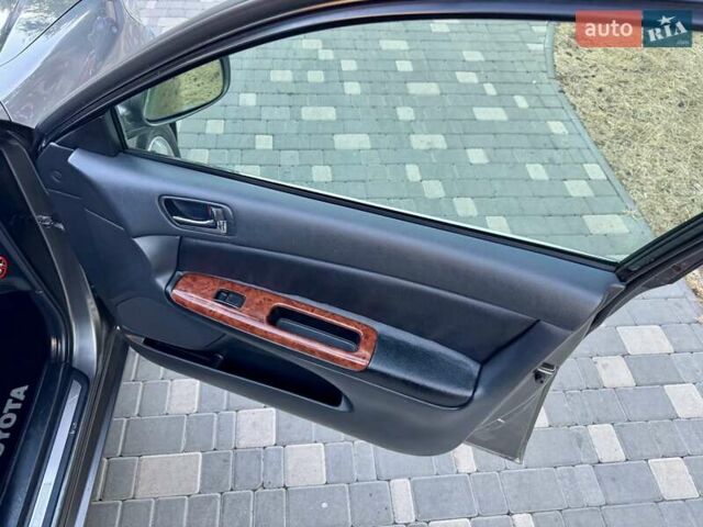 Серый Тойота Камри, объемом двигателя 2.4 л и пробегом 257 тыс. км за 5400 $, фото 34 на Automoto.ua