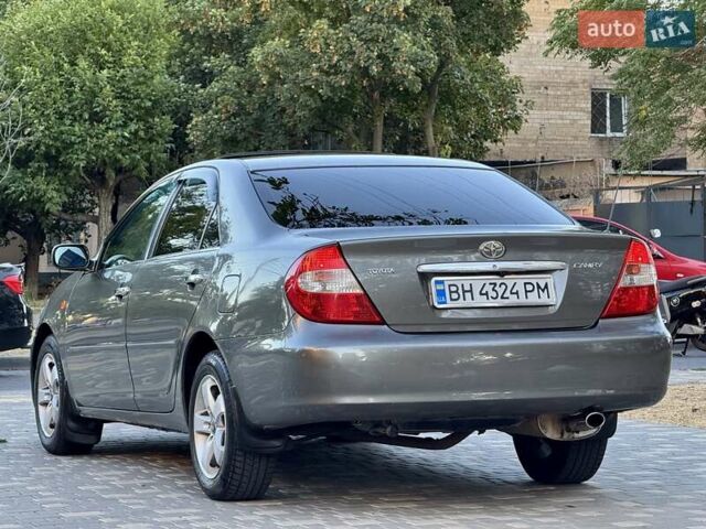 Серый Тойота Камри, объемом двигателя 2.4 л и пробегом 257 тыс. км за 5400 $, фото 60 на Automoto.ua