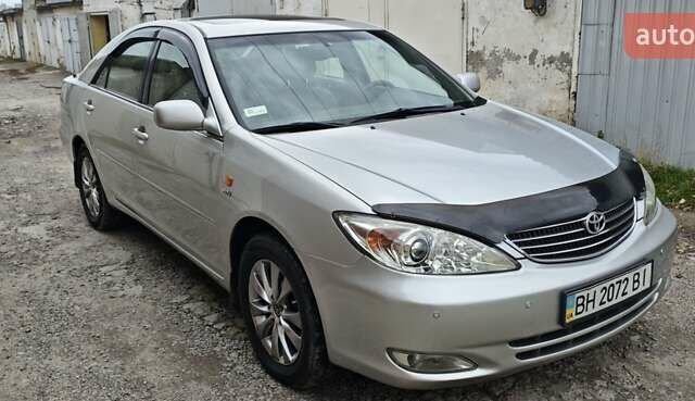Серый Тойота Камри, объемом двигателя 2.36 л и пробегом 260 тыс. км за 6500 $, фото 1 на Automoto.ua