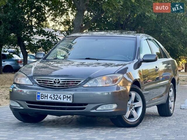 Серый Тойота Камри, объемом двигателя 2.4 л и пробегом 257 тыс. км за 5400 $, фото 5 на Automoto.ua