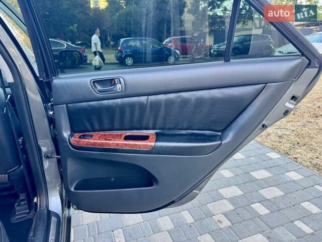 Серый Тойота Камри, объемом двигателя 2.4 л и пробегом 257 тыс. км за 5400 $, фото 47 на Automoto.ua