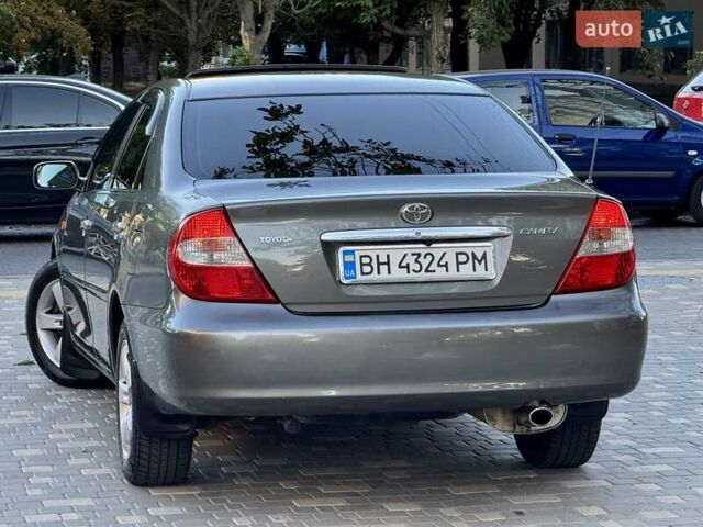 Серый Тойота Камри, объемом двигателя 2.4 л и пробегом 257 тыс. км за 5400 $, фото 78 на Automoto.ua