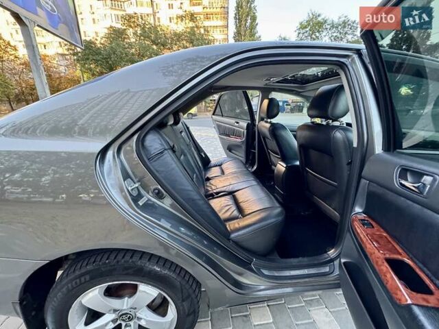 Серый Тойота Камри, объемом двигателя 2.4 л и пробегом 257 тыс. км за 5400 $, фото 21 на Automoto.ua