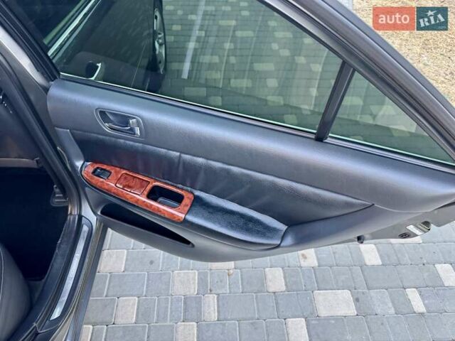 Серый Тойота Камри, объемом двигателя 2.4 л и пробегом 257 тыс. км за 5400 $, фото 28 на Automoto.ua