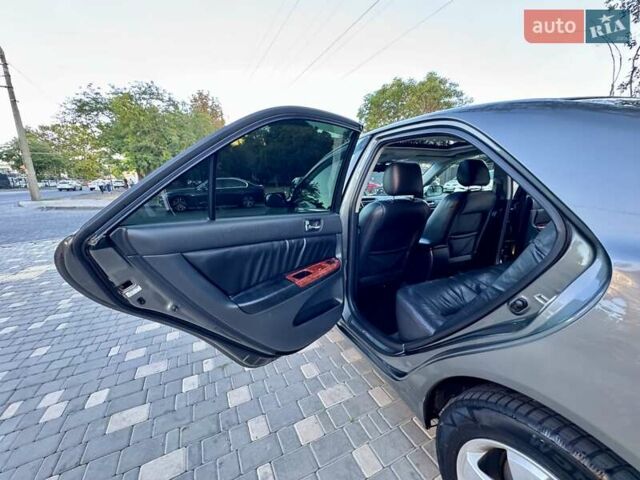 Серый Тойота Камри, объемом двигателя 2.4 л и пробегом 257 тыс. км за 5400 $, фото 23 на Automoto.ua