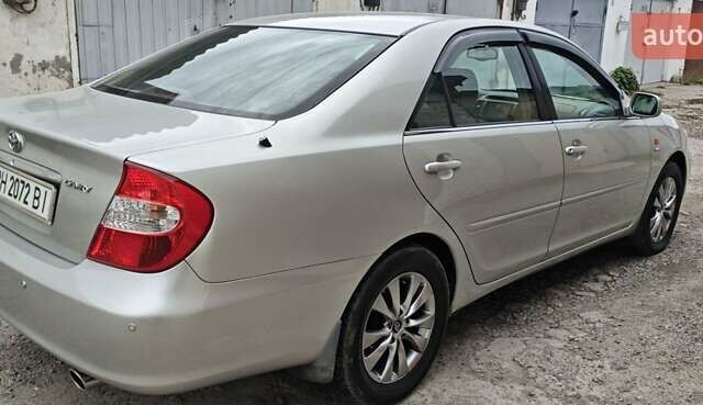 Серый Тойота Камри, объемом двигателя 2.36 л и пробегом 260 тыс. км за 6500 $, фото 12 на Automoto.ua