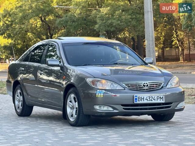 Серый Тойота Камри, объемом двигателя 2.4 л и пробегом 257 тыс. км за 5400 $, фото 3 на Automoto.ua