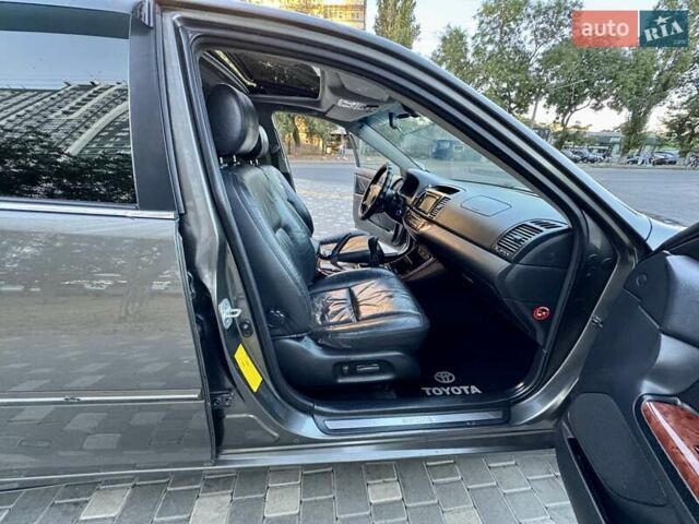 Серый Тойота Камри, объемом двигателя 2.4 л и пробегом 257 тыс. км за 5400 $, фото 36 на Automoto.ua