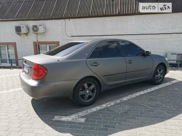 Серый Тойота Камри, объемом двигателя 3 л и пробегом 406 тыс. км за 5500 $, фото 4 на Automoto.ua