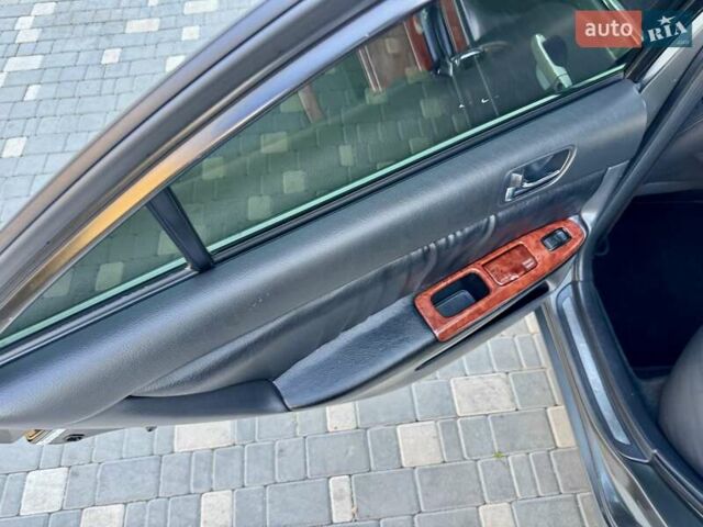 Серый Тойота Камри, объемом двигателя 2.4 л и пробегом 257 тыс. км за 5400 $, фото 19 на Automoto.ua