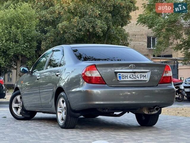 Серый Тойота Камри, объемом двигателя 2.4 л и пробегом 257 тыс. км за 5400 $, фото 56 на Automoto.ua