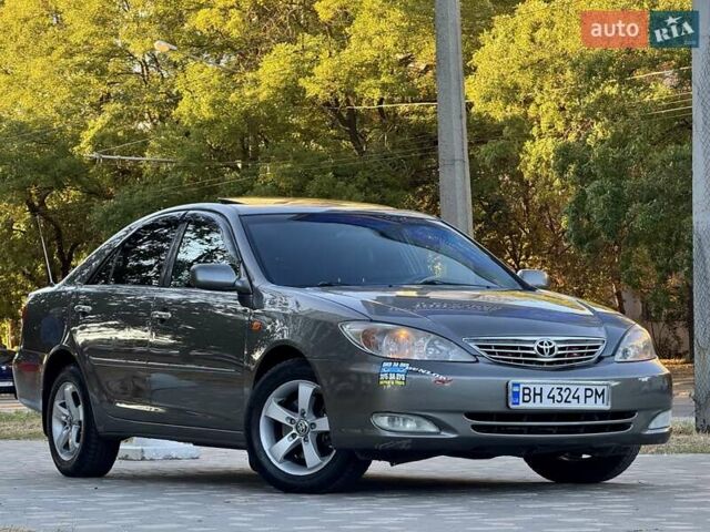 Серый Тойота Камри, объемом двигателя 2.4 л и пробегом 257 тыс. км за 5400 $, фото 65 на Automoto.ua
