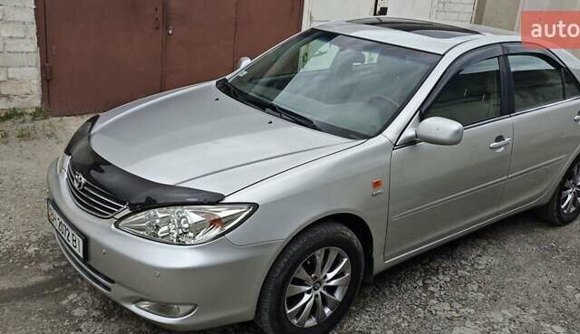 Серый Тойота Камри, объемом двигателя 2.36 л и пробегом 260 тыс. км за 6500 $, фото 10 на Automoto.ua