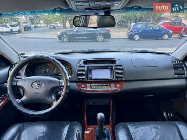 Серый Тойота Камри, объемом двигателя 2.4 л и пробегом 257 тыс. км за 5400 $, фото 12 на Automoto.ua