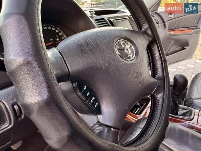 Серый Тойота Камри, объемом двигателя 2.4 л и пробегом 257 тыс. км за 5400 $, фото 43 на Automoto.ua