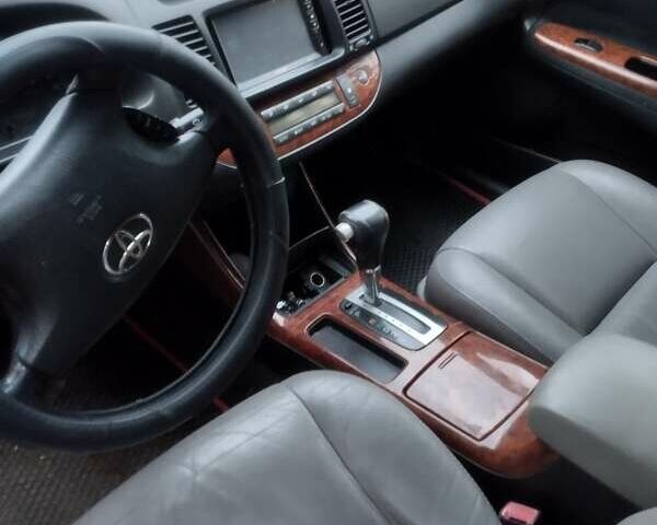 Серый Тойота Камри, объемом двигателя 2.4 л и пробегом 250 тыс. км за 4500 $, фото 5 на Automoto.ua